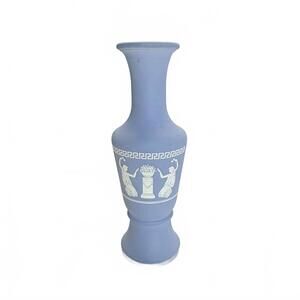 A vintage Avon matte blue ceramic vase with classical relief decoration.